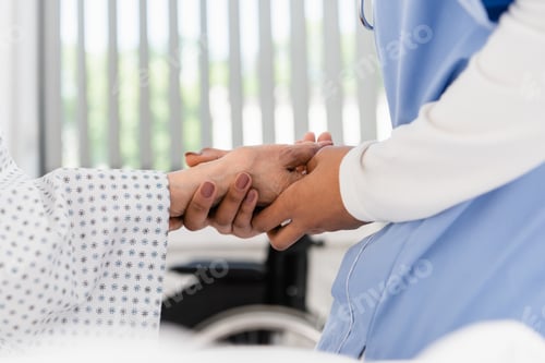 Preview: Cropped view of african american nurse holding hand of senior patient