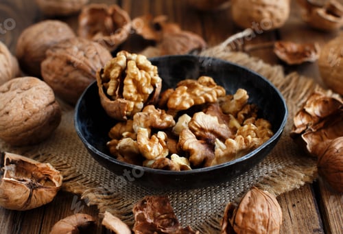 Preview: Fresh walnuts on an old wooden table