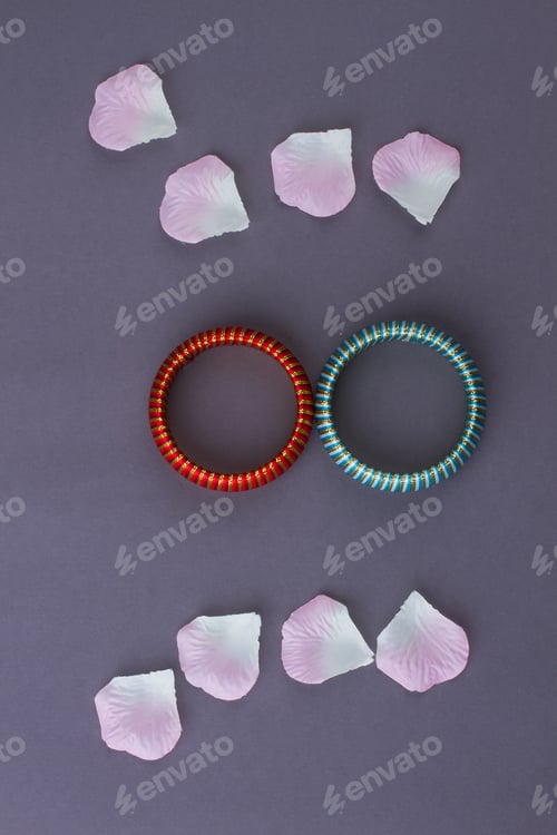 Preview: Two braceletes and flowers petals.