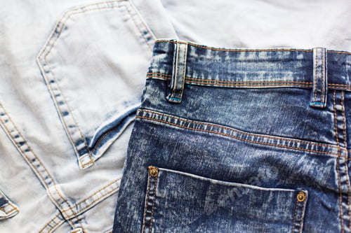 Preview: Close-Up of Two Pairs of Denim Jeans