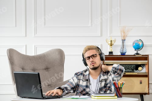 Preview: student online studying remote young cute guy on computer at home tired