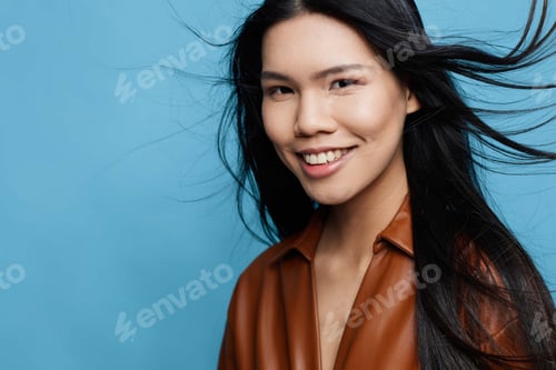 Preview: Studio woman blue background trendy girl smile happy asian