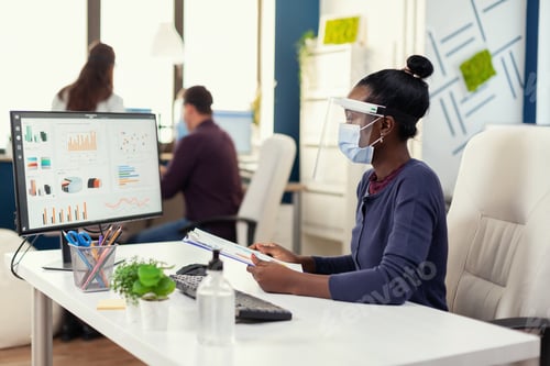 Preview: African businesswoman checking financial analysis