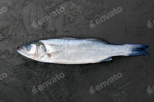 Preview: Seabass fish on black stone table