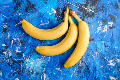 Preview: Banana fruits on blue textured background