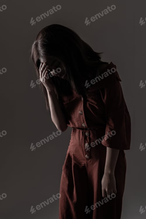 Preview: Portrait of a beautiful natural young African woman possing over black background