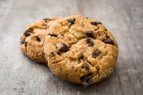 Preview: Two delicious chocolate chip cookies resting on gray surface