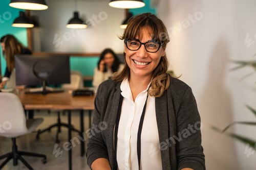 Preview: Happy Latin woman in coworking creative space