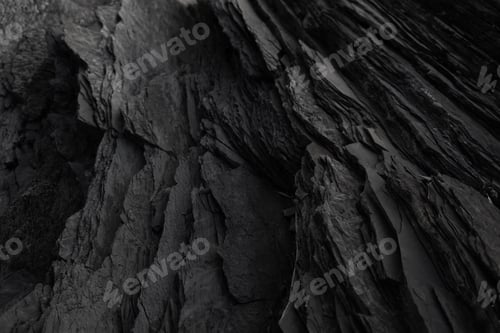 Preview: Black rock background. layered mountain surface close up. dark stone texture.