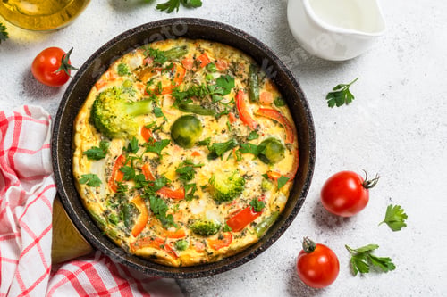 Preview: Frittata with vegetables on white stone table
