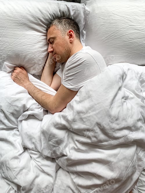 Preview: Middle aged adult man sleeping at home Cozy bedroom bed vibes white bedsheets Alone Early morning