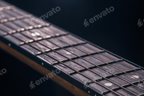 Preview: Close-up of an acoustic guitar fretboard copy space.