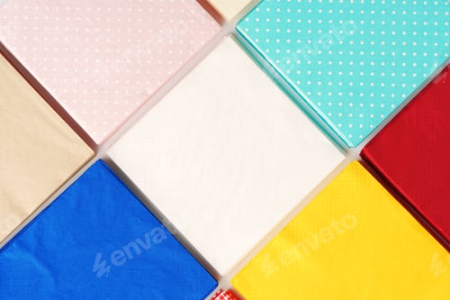 Preview: Colorful square paper napkins background top view