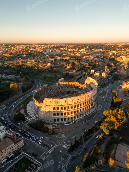 Preview: vertical aerial drone view Colosseum in Rome against sunrise sky