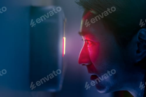 Preview: Iris scanner man using biometrics to unlock a door