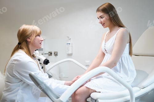 Preview: Beautiful young woman at a gynecologists appointment at medical center