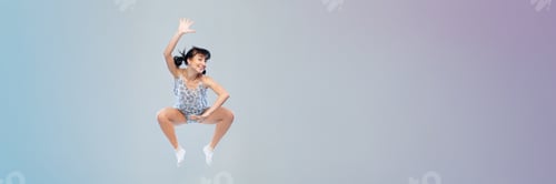 Preview: Happy woman jumping in the air, wide banner with copy space