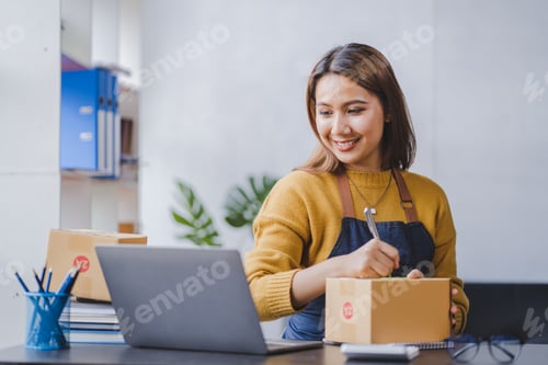 Preview: Portrait of a small business startup, SME owner, female entrepreneur, working, unboxing, checking or