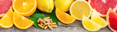 Preview: citrus essential oil in a bottle. Selective focus.