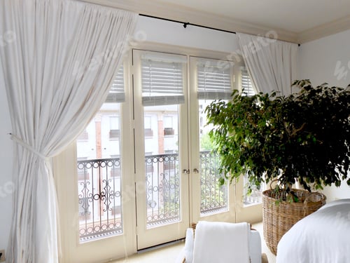 Preview: A bright and airy bedroom bathed in natural light.