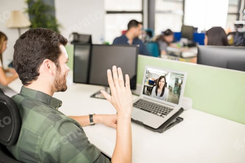 Preview: Man making video call with laptop in office