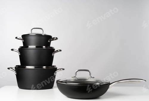 Preview: New domestic cookware on grey background close up