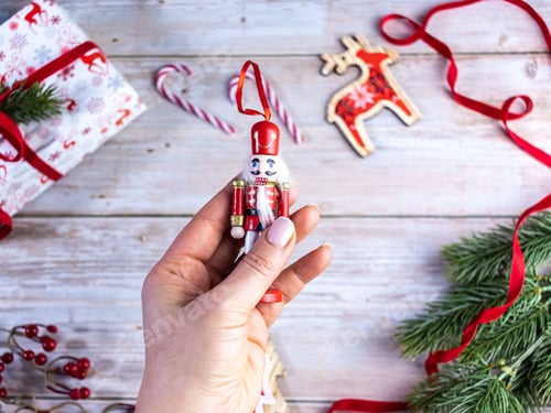 Preview: christmas decorations on the tree a soldier is in the hand