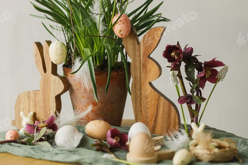 Preview: Happy Easter! Stylish wooden bunny, natural eggs, spring flowerpot and flowers