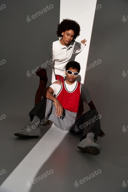 Preview: Young couple showcasing love and style in a modern, minimalist setting during daylight hours