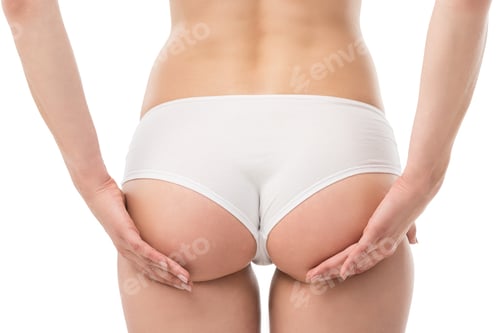 Preview: back view of sexy woman in panties touching buttocks isolated on white