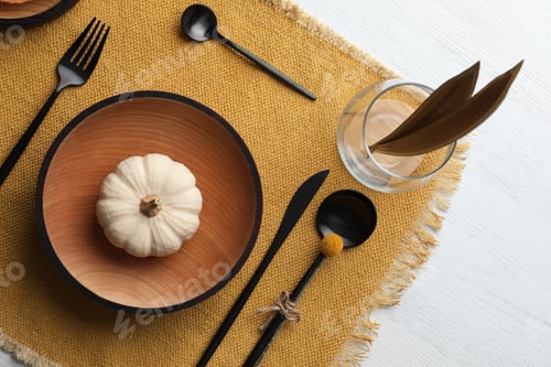 Preview: Autumn table setting with pumpkin on white wooden background, flat lay