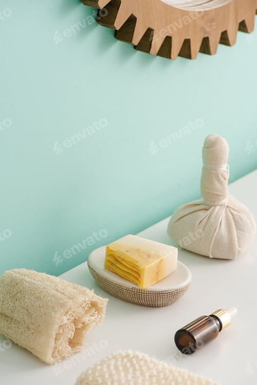 Preview: Loofah, Bottle of Cosmetic Oil, Soap And Thai Herbal Compress Ball in Bathroom, Zero Waste Concept