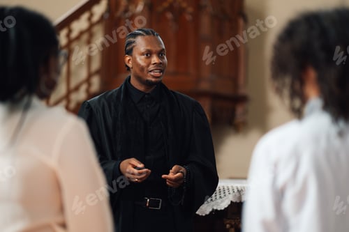 Preview: Young priest speaking to congregation in church