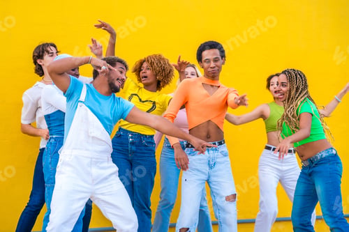 Preview: Multicultural group of happy young people dancing together