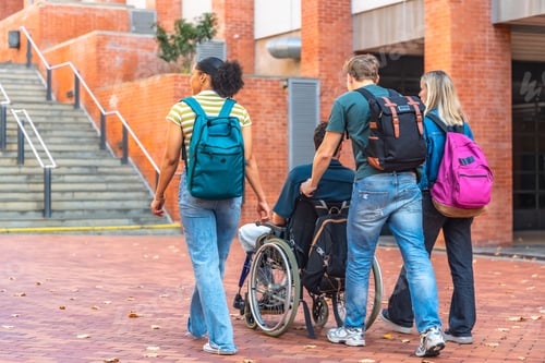 Preview: University students pushing friend in wheelchair on campus