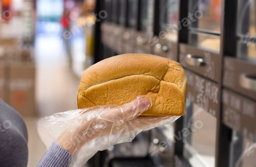 Preview: Female Hand Choosing Bread In The Market