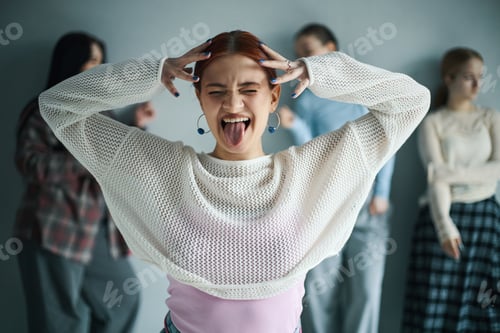 Preview: Young Woman Having Fun and Making Funny Face Gesture