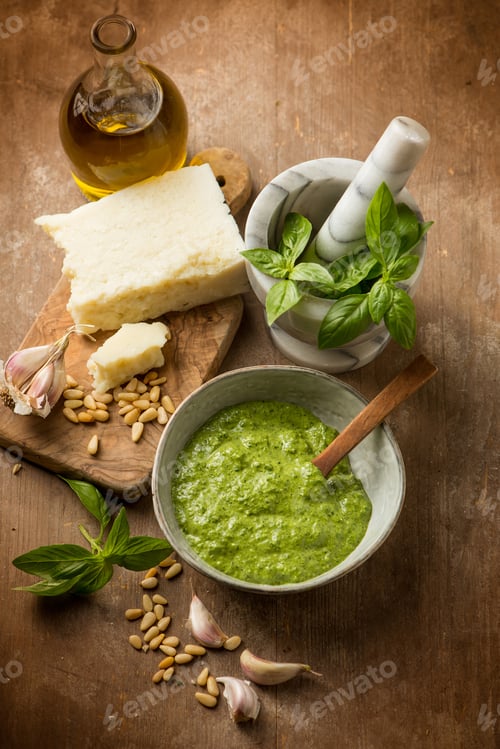 Preview: bowl with traditional italian pesto and ingredients