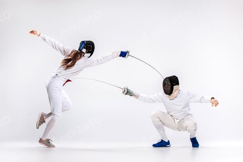 Preview: The woman and man wearing fencing suit practicing with sword against gray