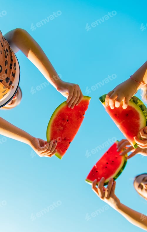 Preview: Children eat watermelon in summer. Selective focus.