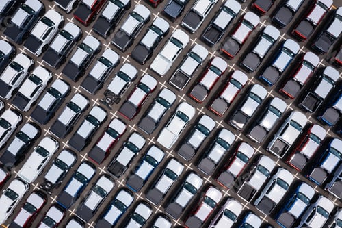 Preview: Large Parking Lot Filled with New Pickup Trucks