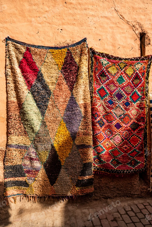 Preview: an open window in front of a building with blankets hanging up