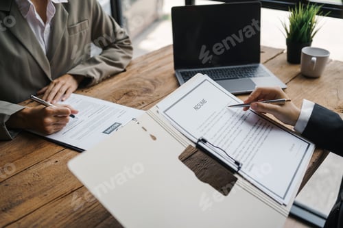 Preview: Close-up of business owner check resume of job applicants in company at the office.