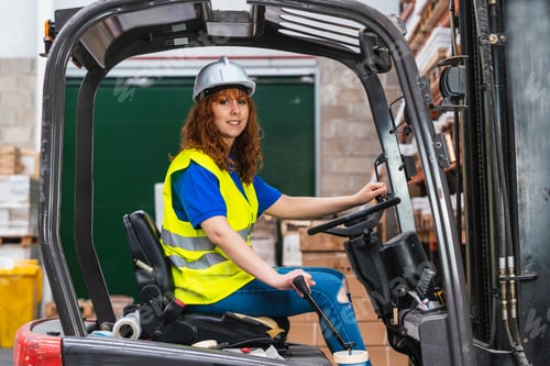 Preview: Portrait of a smiling worker posing during work in a warehouse