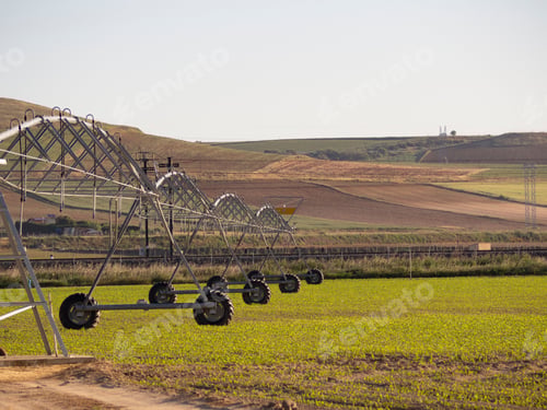 Preview: Picturesque view with the pivot irrigation system on farmland in the spring