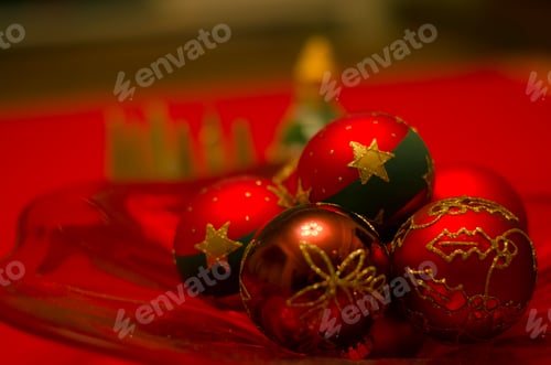 Preview: Colorful red baubles arranged as simple Christmas decorations on a red background.