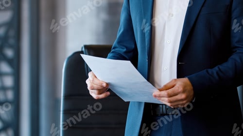 Preview: Young corporate leader in a suit at a business meeting