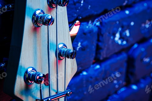 Preview: Guitar headstock with tuners on dark background