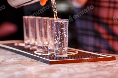 Preview: Barman at work, preparing cocktails.