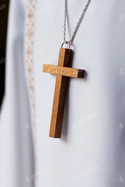 Preview: detail of a wooden cross of a child about to receive the first communion